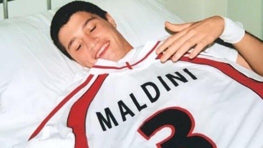 Pisacane at age 13 in the hospital with a Maldini jersey as a gift